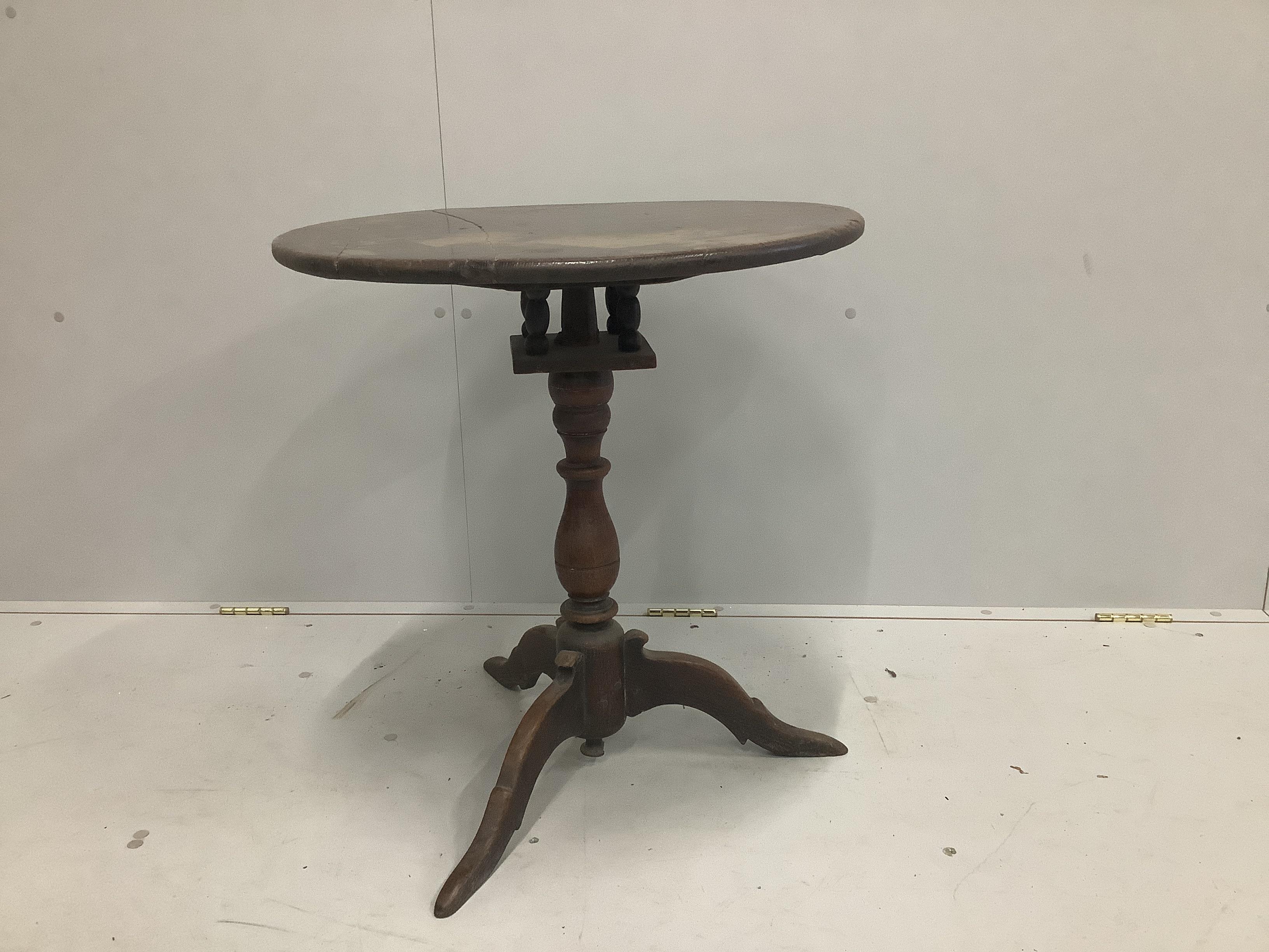 A mid 18th century oak tripod table with bird cage stem, width 60cm, height 63cm